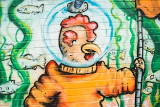 A vibrant illustration of Cluck Muck in his leather jacket with a chainsaw.