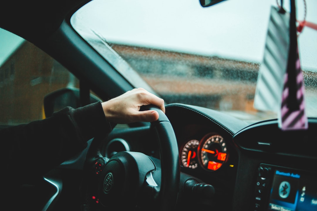 person driving car during daytime