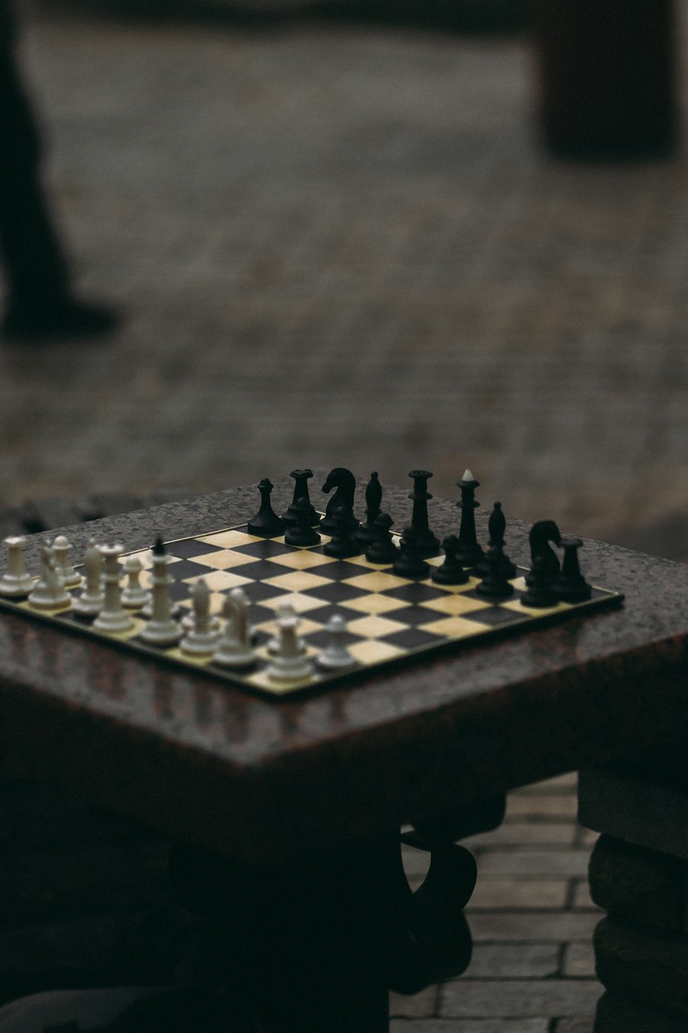 black and white chess piece on brown wooden chess board