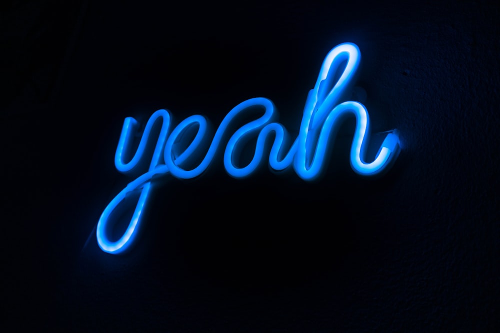 blue and white love neon light signage