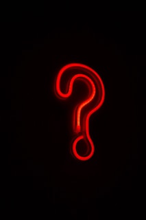 red letter b on black background