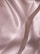 Soft, flowing fabric with a smooth, shiny texture featuring gentle folds and a subtle sheen, creating an elegant and luxurious appearance.