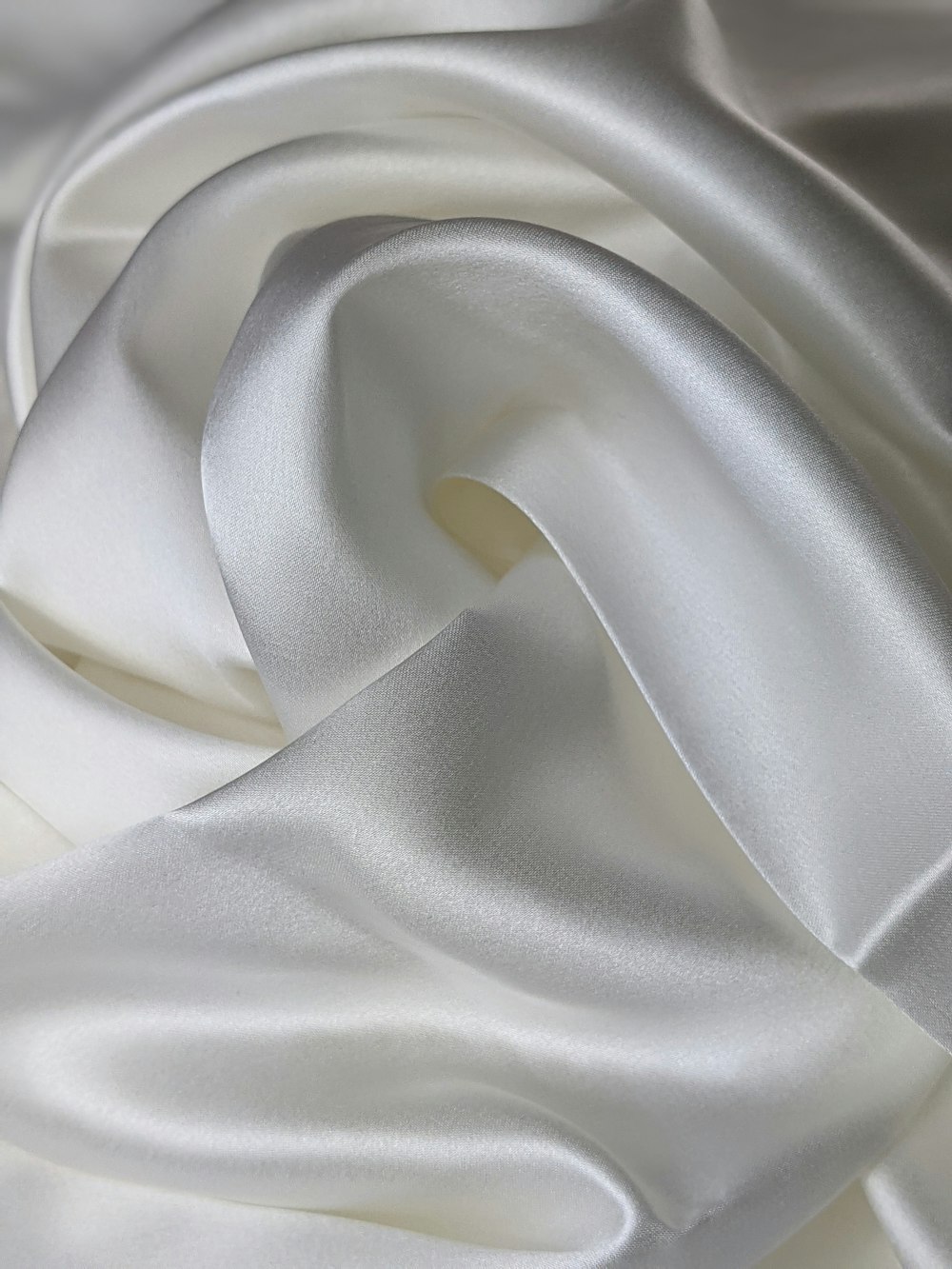 white textile on white textile