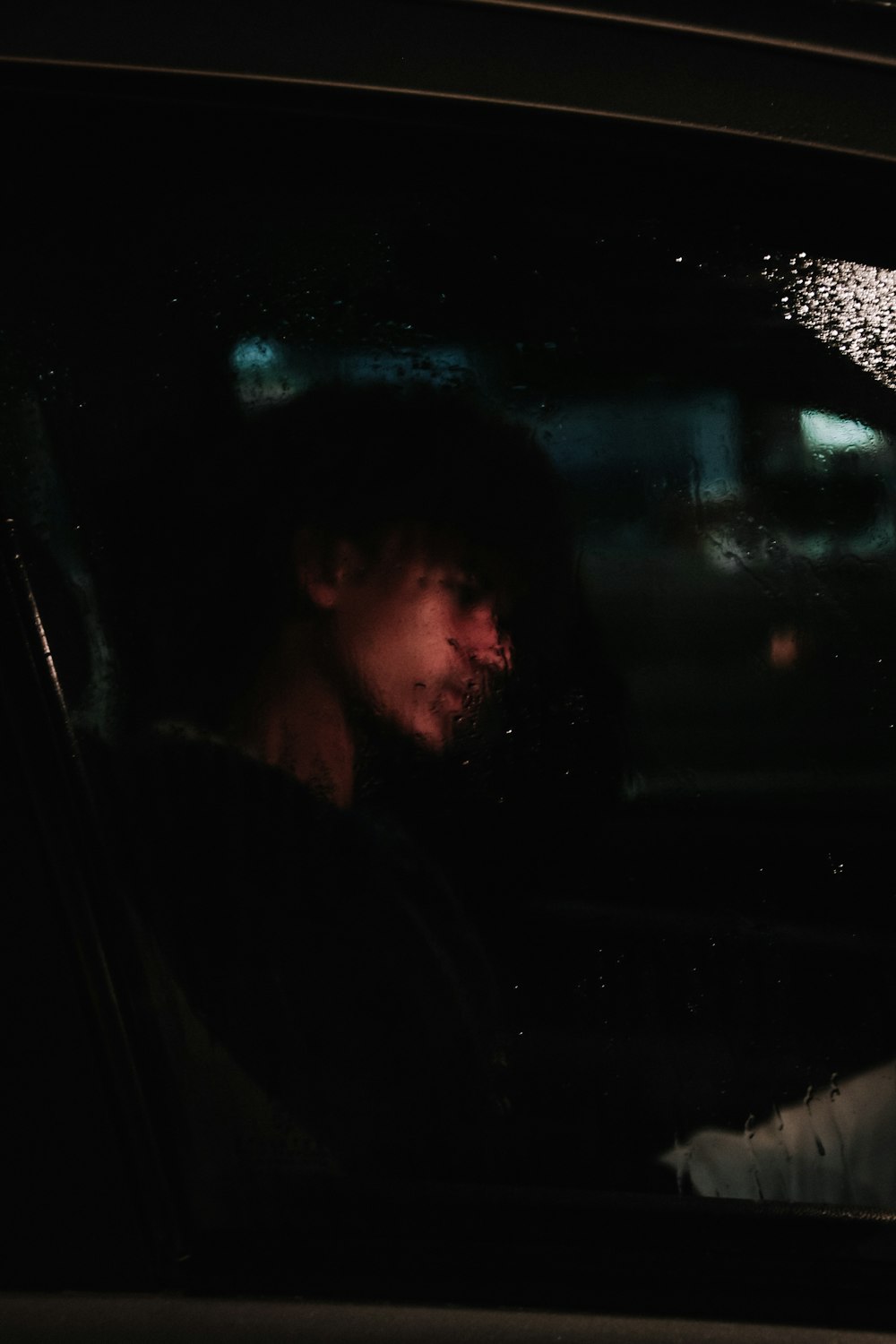 man in car during night time