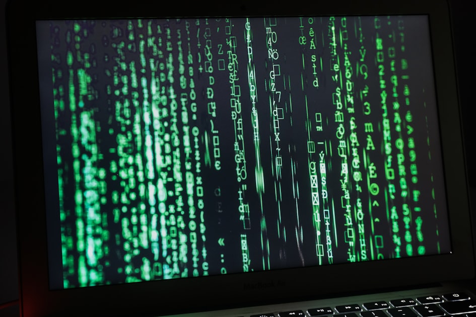 Matrix-style security code on a MacBook Pro screen representing AI command-line tool capabilities