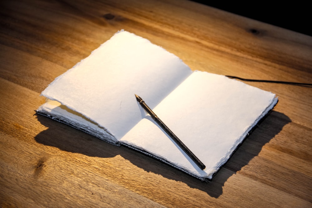 white paper on brown wooden table