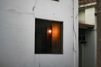 Electrician fixing wiring inside a home wall