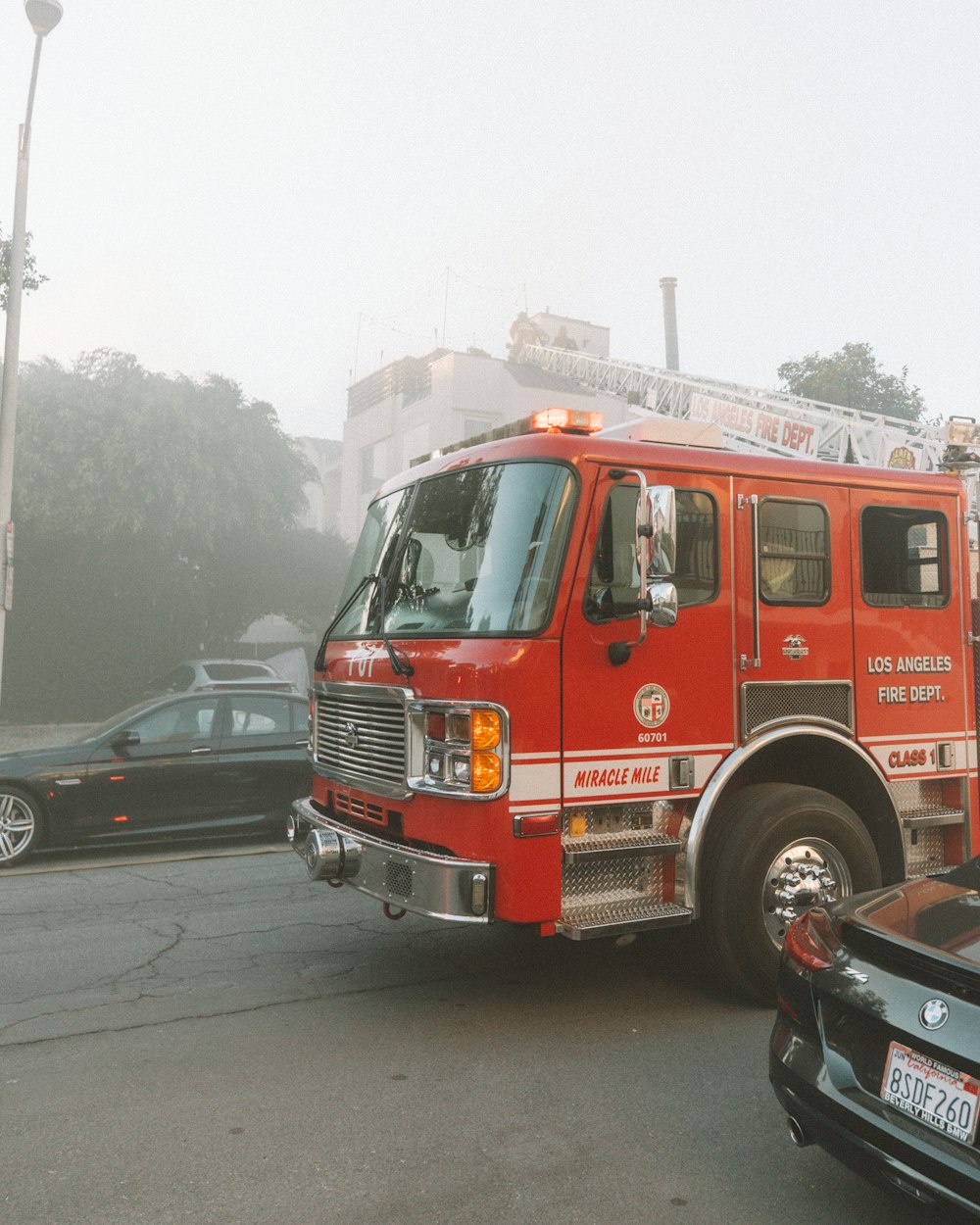 red and white fire truck on road during daytime