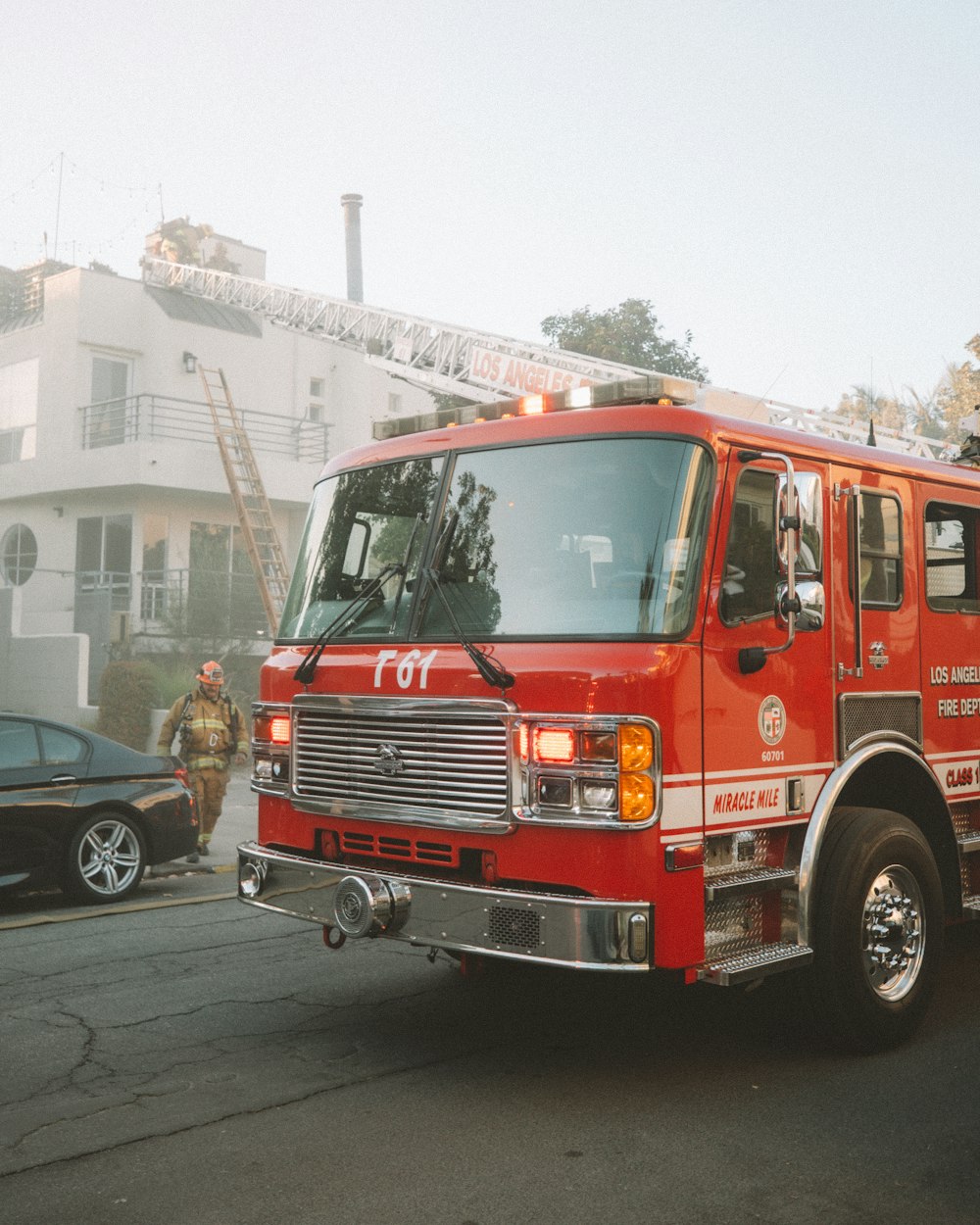 red and white fire truck on road during daytime