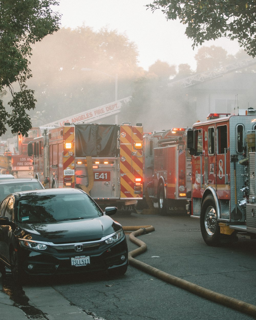 red and white fire truck on road during daytime