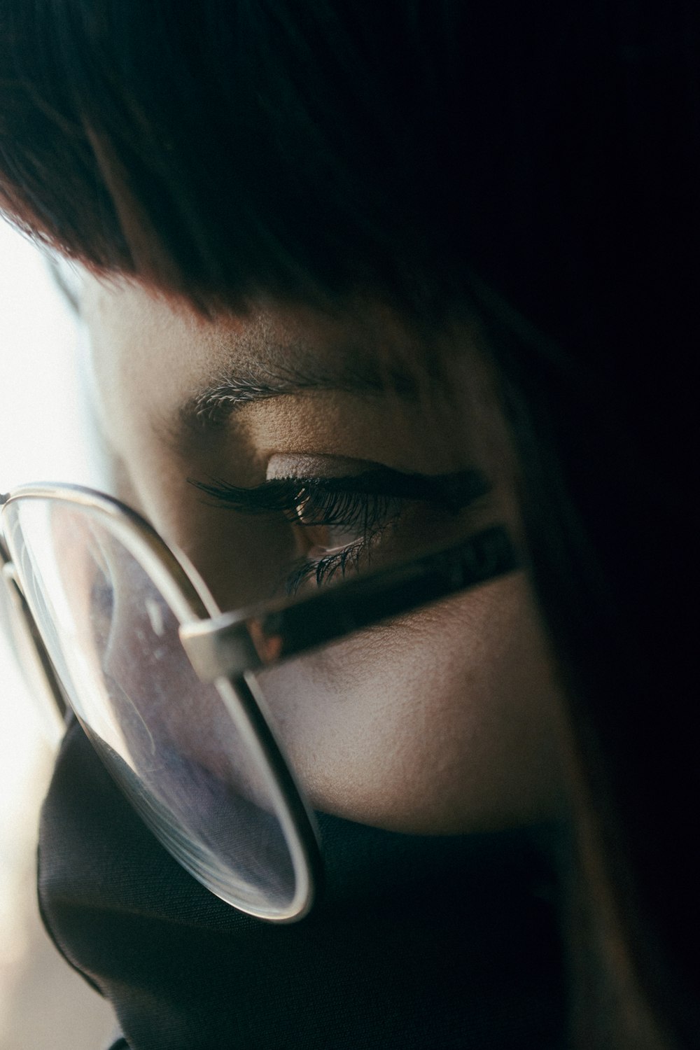 woman wearing black framed eyeglasses