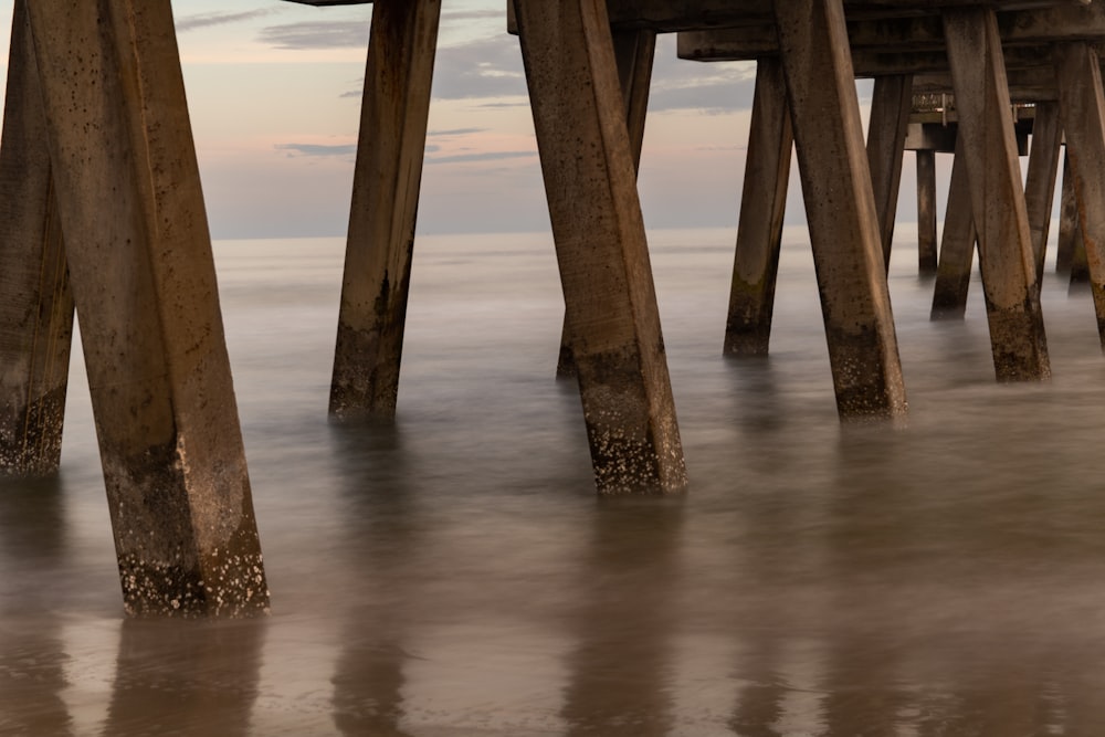 brown wooden dock on sea during daytime