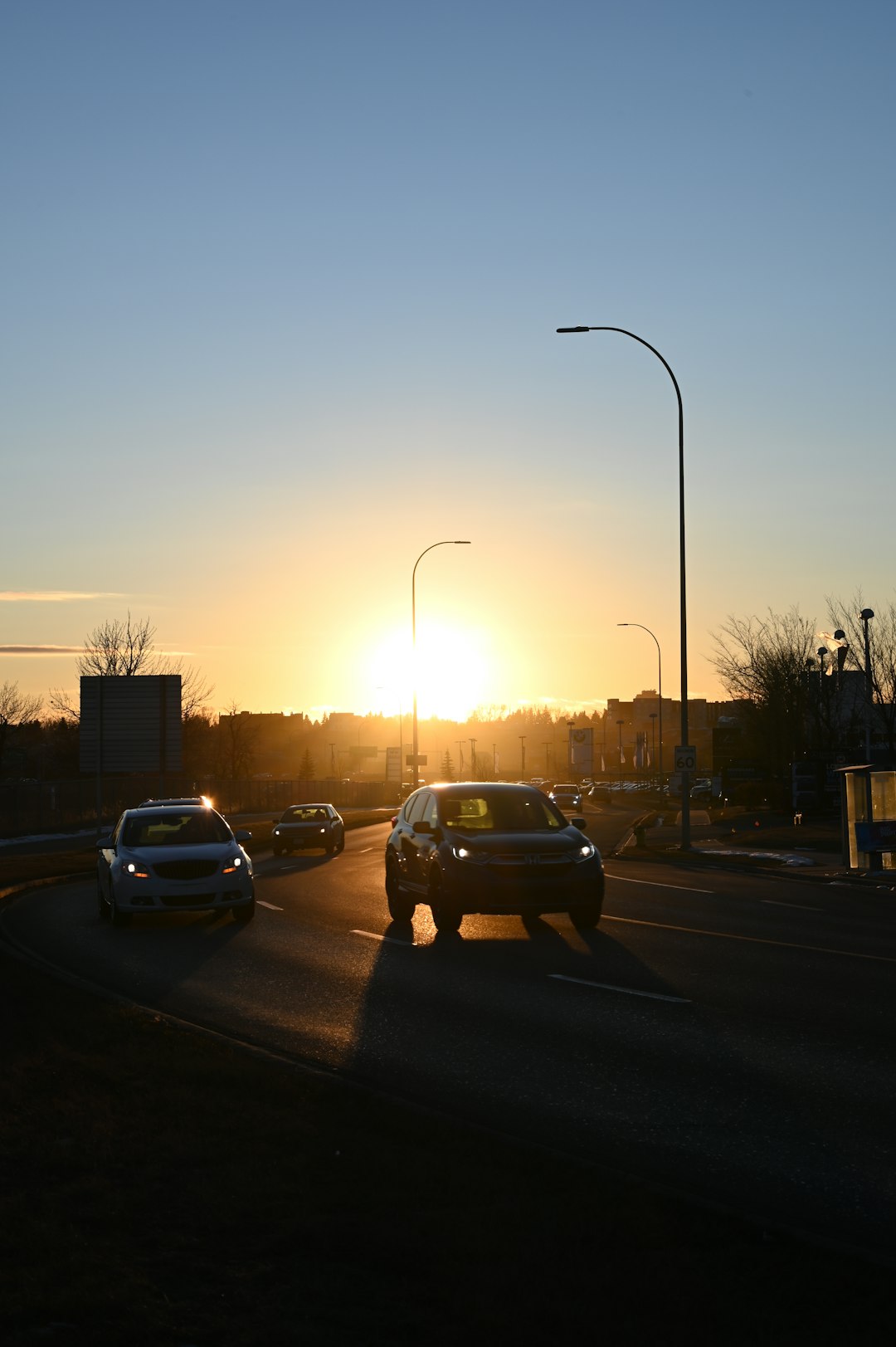 black car on road during sunset