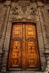 An elegant wooden door with intricate carvings.
