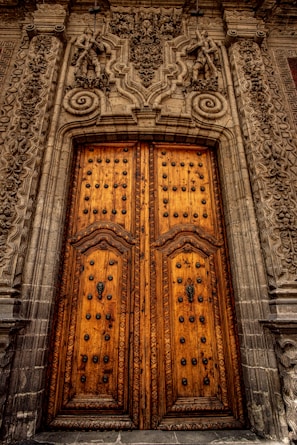 An elegant wooden door with custom carvings.