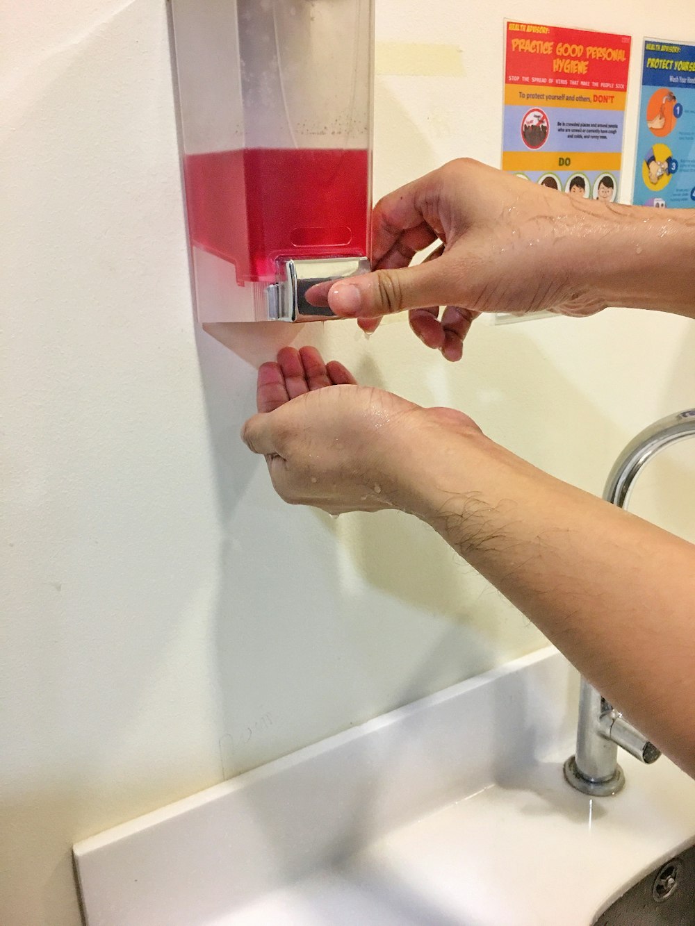 person holding white and red box