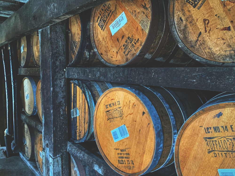 brown wooden barrels on wooden barrels