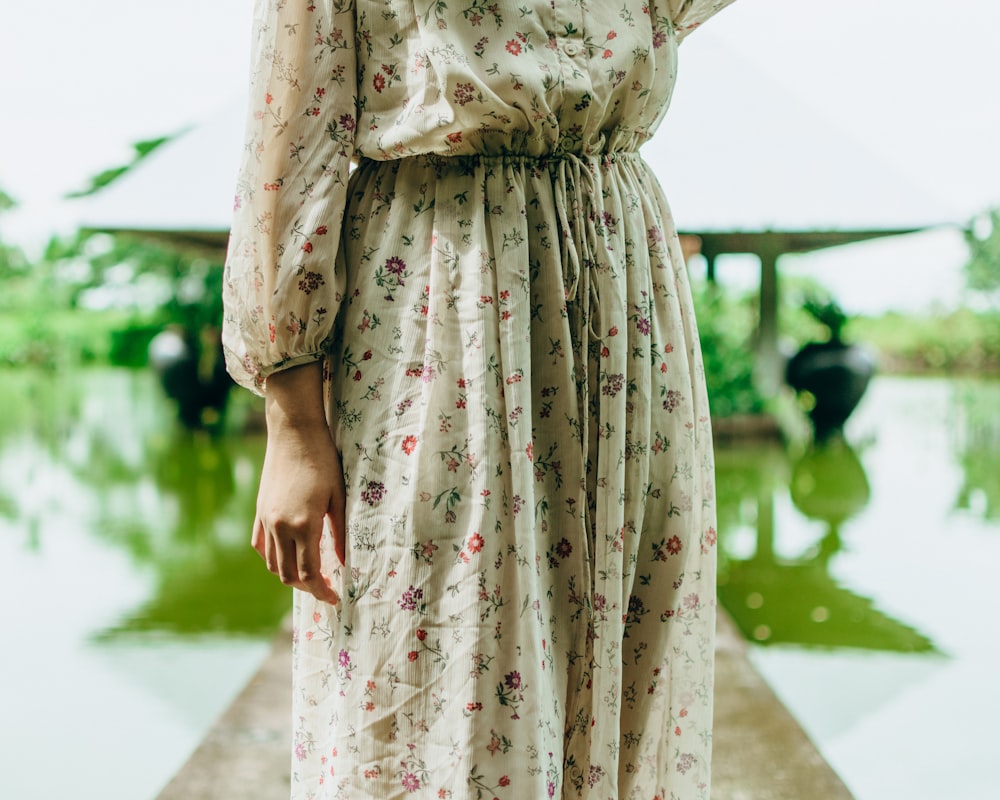 woman in white and red floral dress