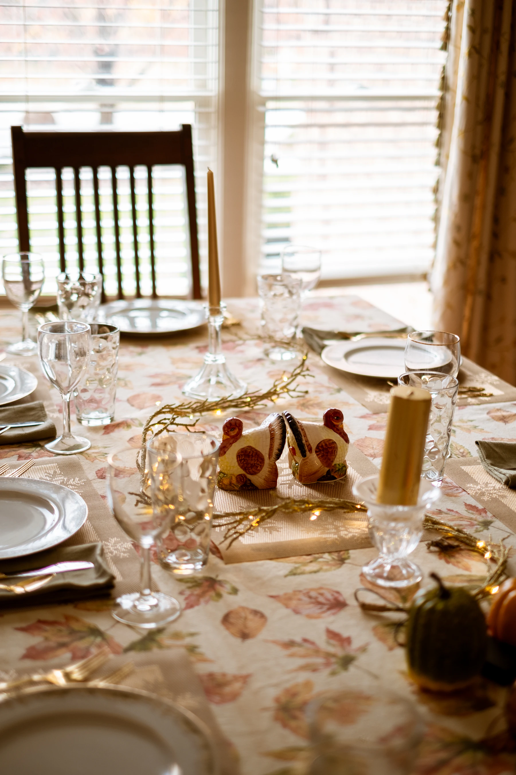 Warm Thanksgiving dinner table with candles