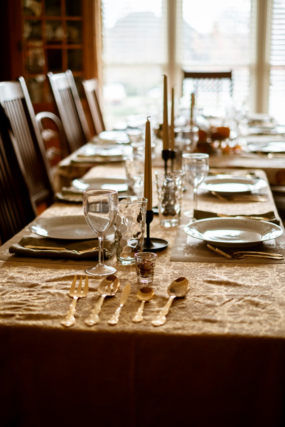 clear wine glasses on brown wooden table