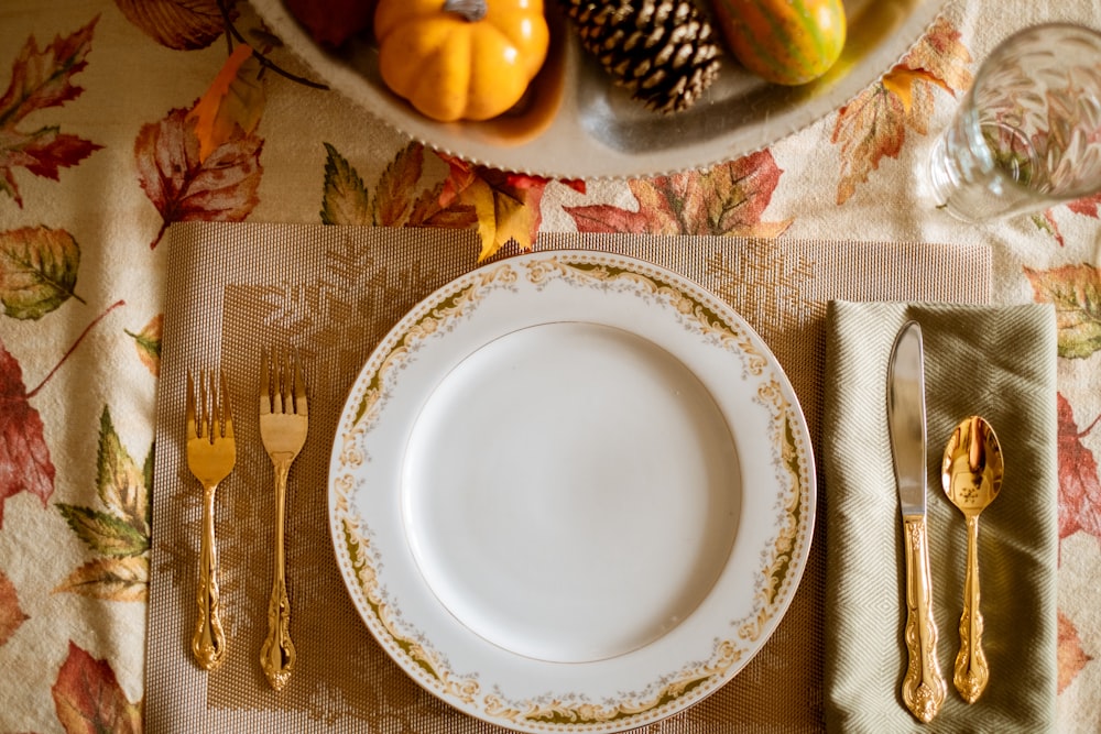 white and blue floral ceramic plate