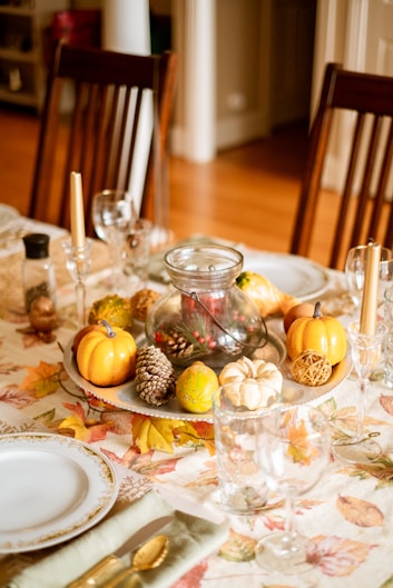 clear glass cups on white and brown floral ceramic plate