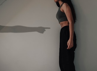 woman in black tank top and black pants