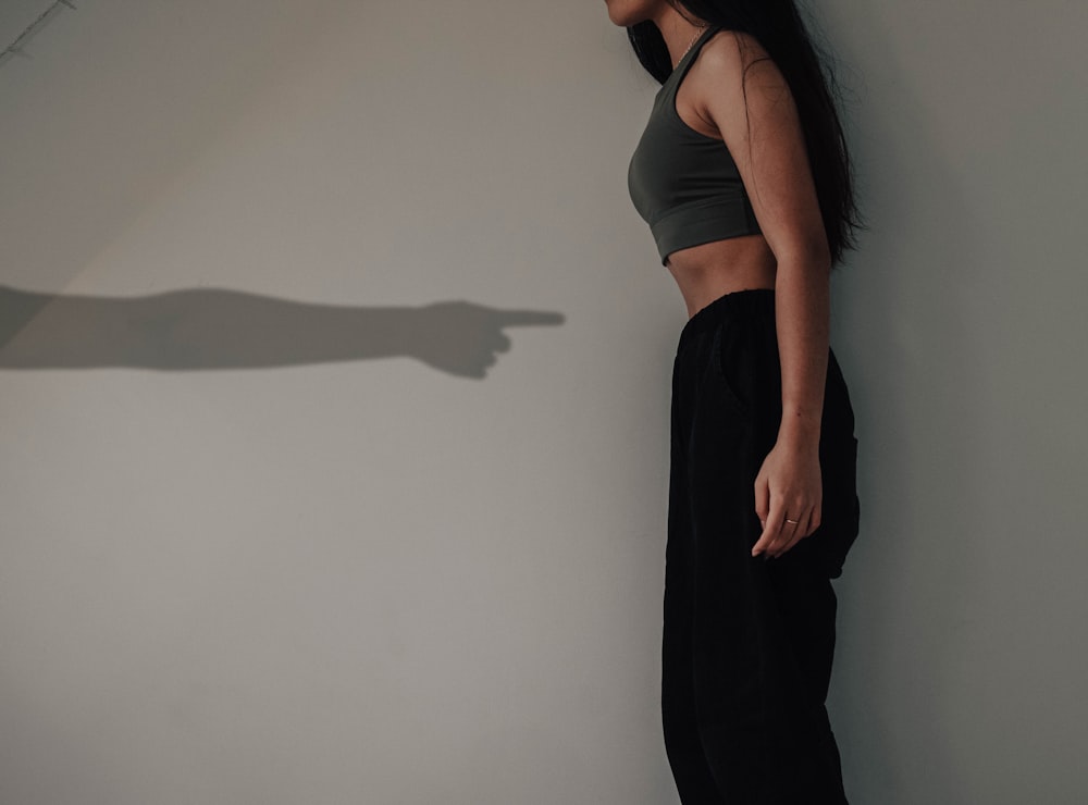 woman in black tank top and black pants