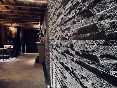 Dimly lit wooden interior with guests enjoying craft beers and steaks