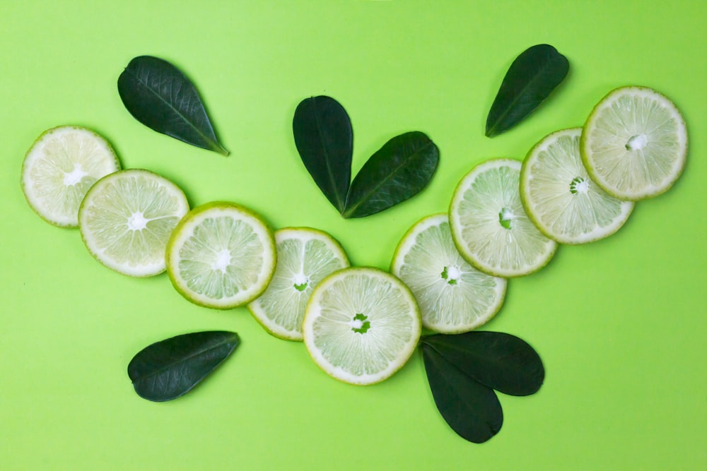 sliced lemon on green surface