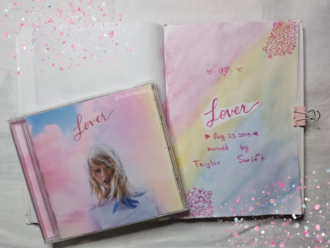 Album cover art featuring soft pastel colors and handwritten lyrics.