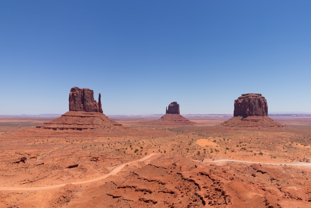 brown sand under blue sky during daytime