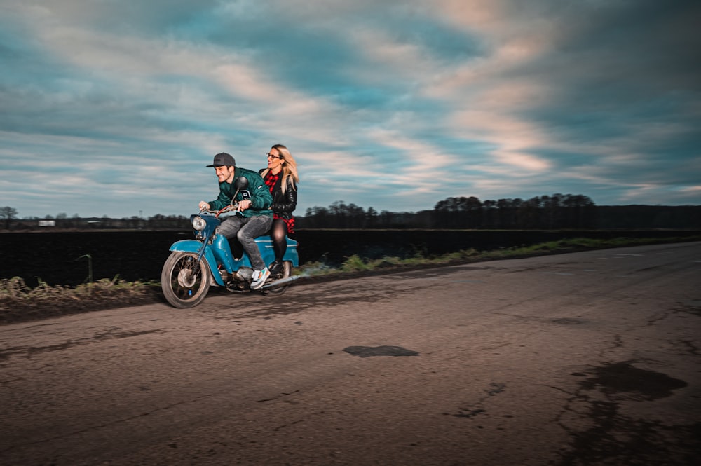 woman in red jacket riding on motorcycle