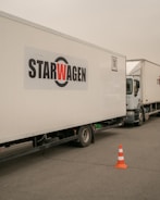 a white truck with a star wagen logo on the side of it
