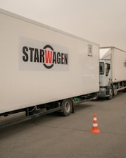 a white truck with a star wagen logo on the side of it