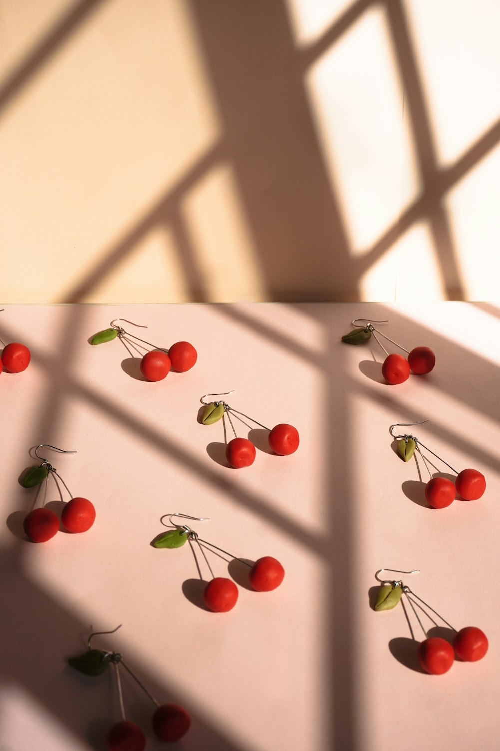 red round fruits on white metal fence