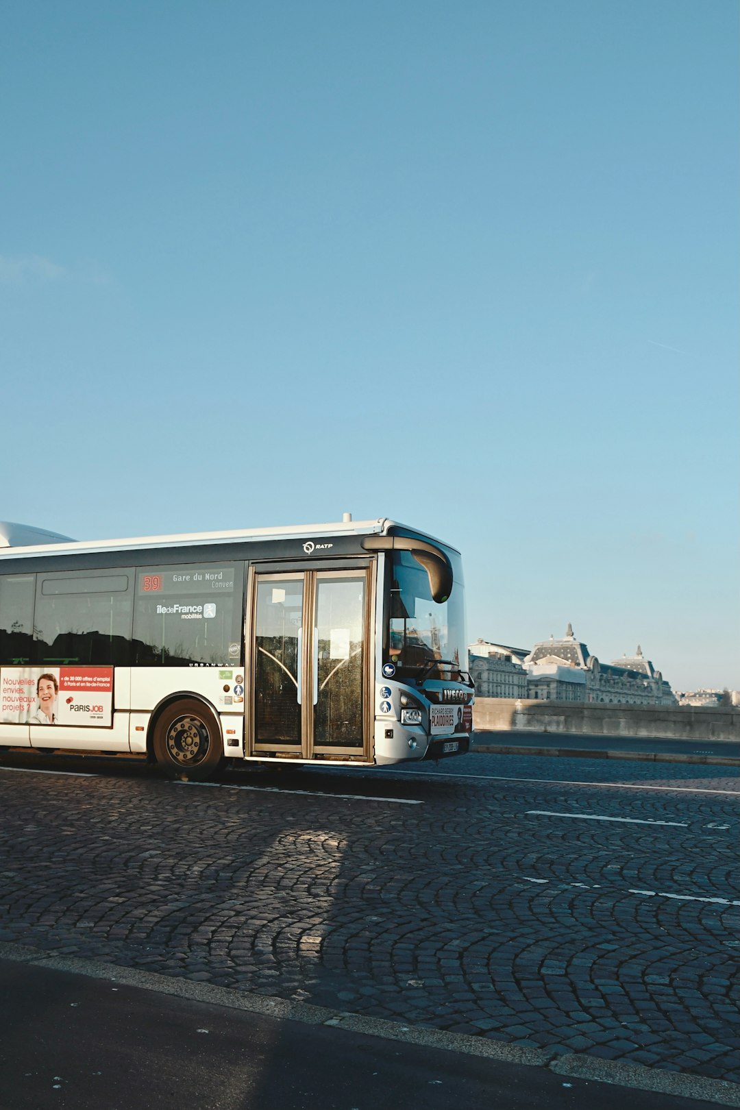 white and brown bus on dock during daytime