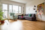 green sofa near glass window