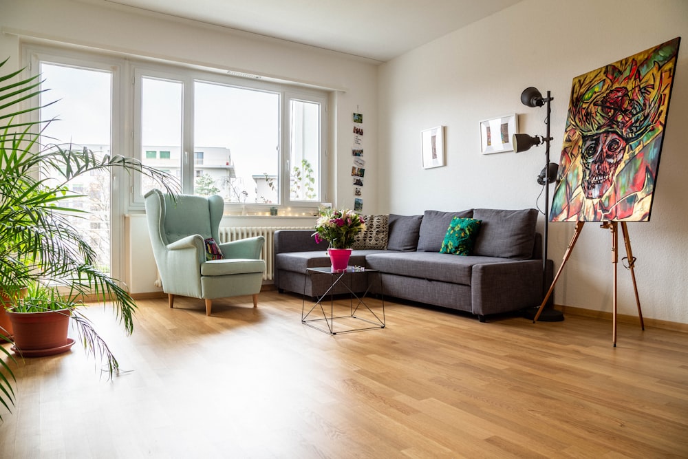 green sofa near glass window