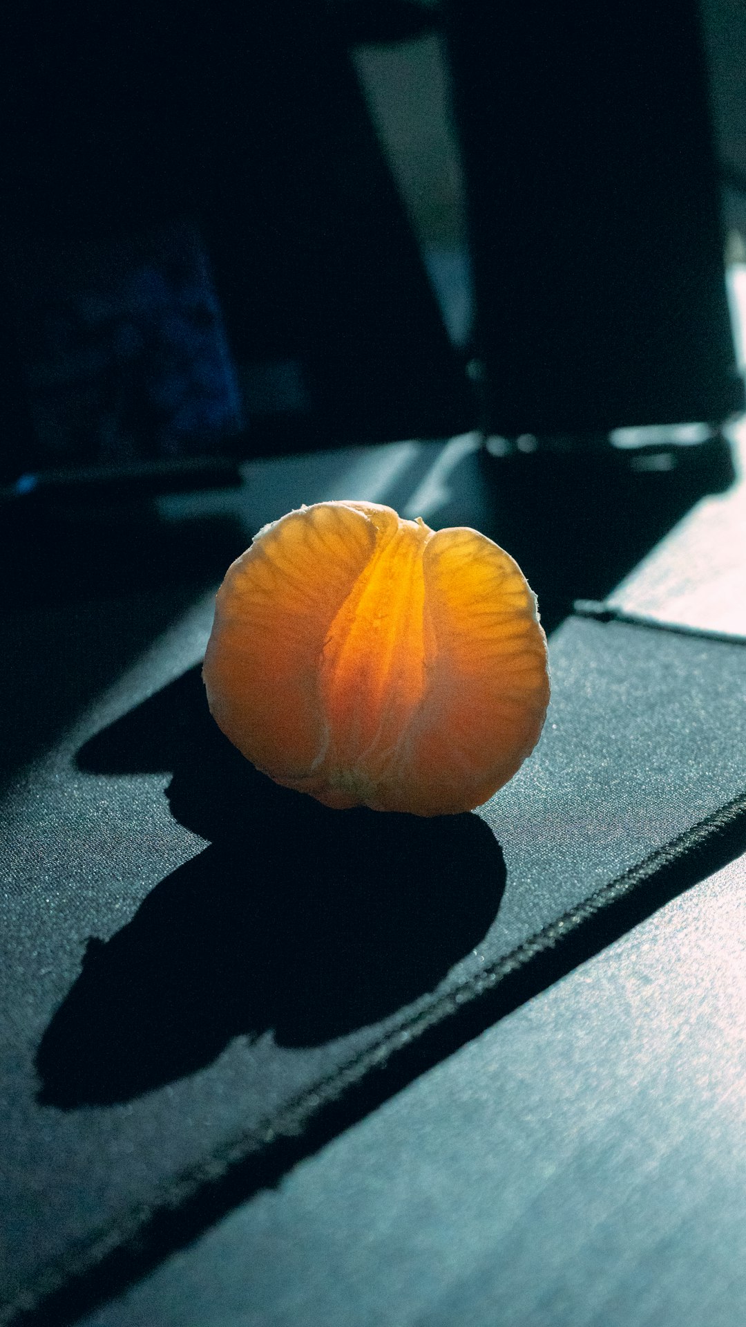 orange fruit on black table