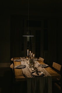 lighted candles on dining table