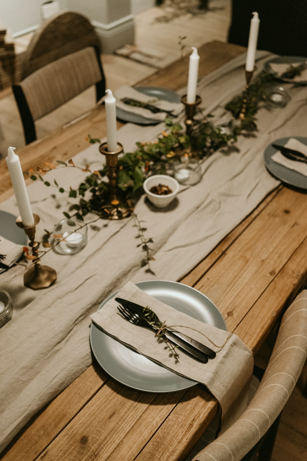 white candles on round black ceramic plate