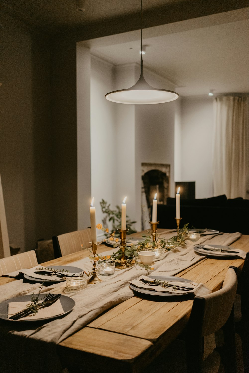 dining table with plates and drinking glasses