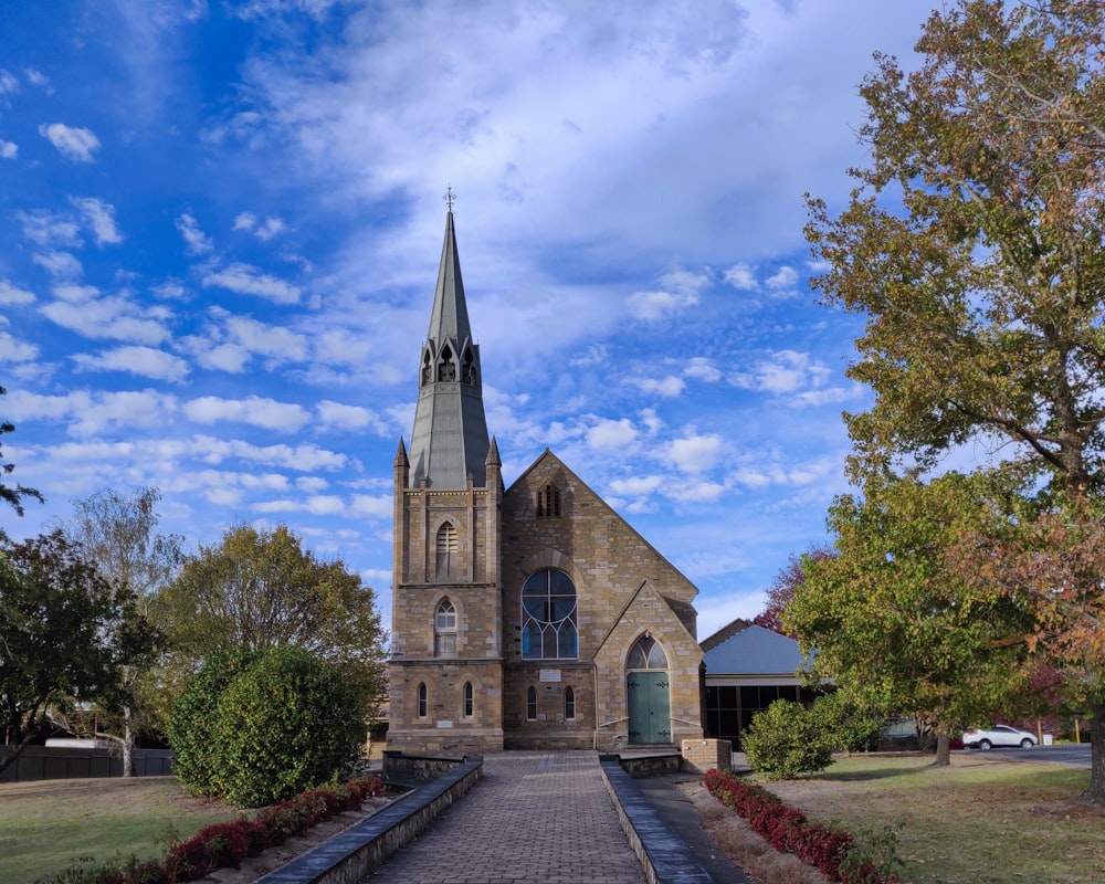 brown and gray concrete church under blue sky during daytime