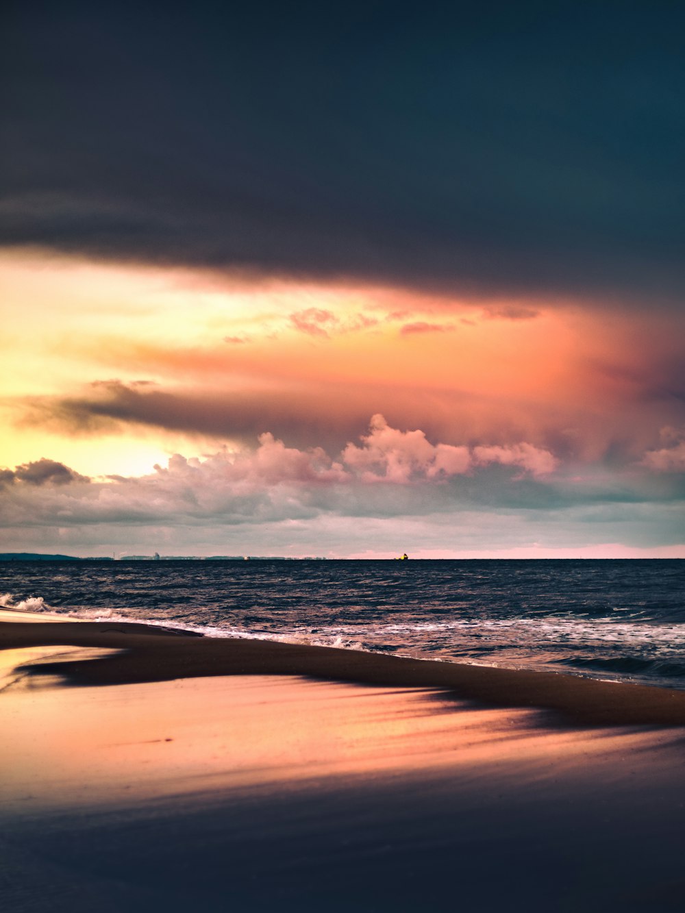 body of water under cloudy sky during daytime