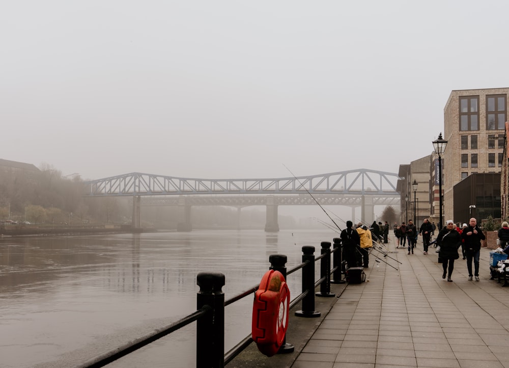 people walking on bridge during daytime