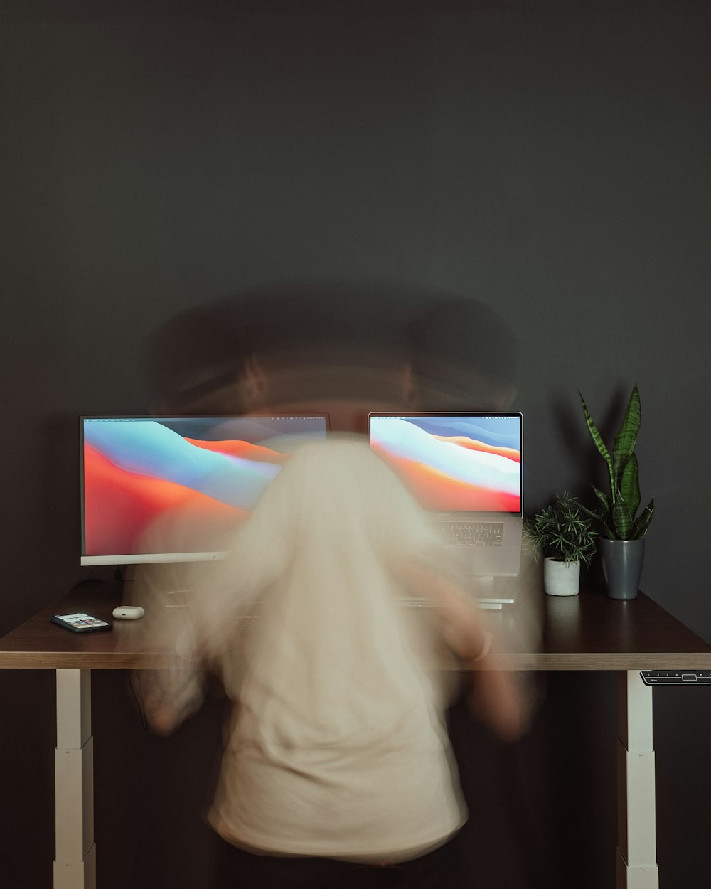 person in white pants watching tv