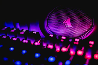 Close-up of a glowing gaming keyboard with vibrant RGB lights.