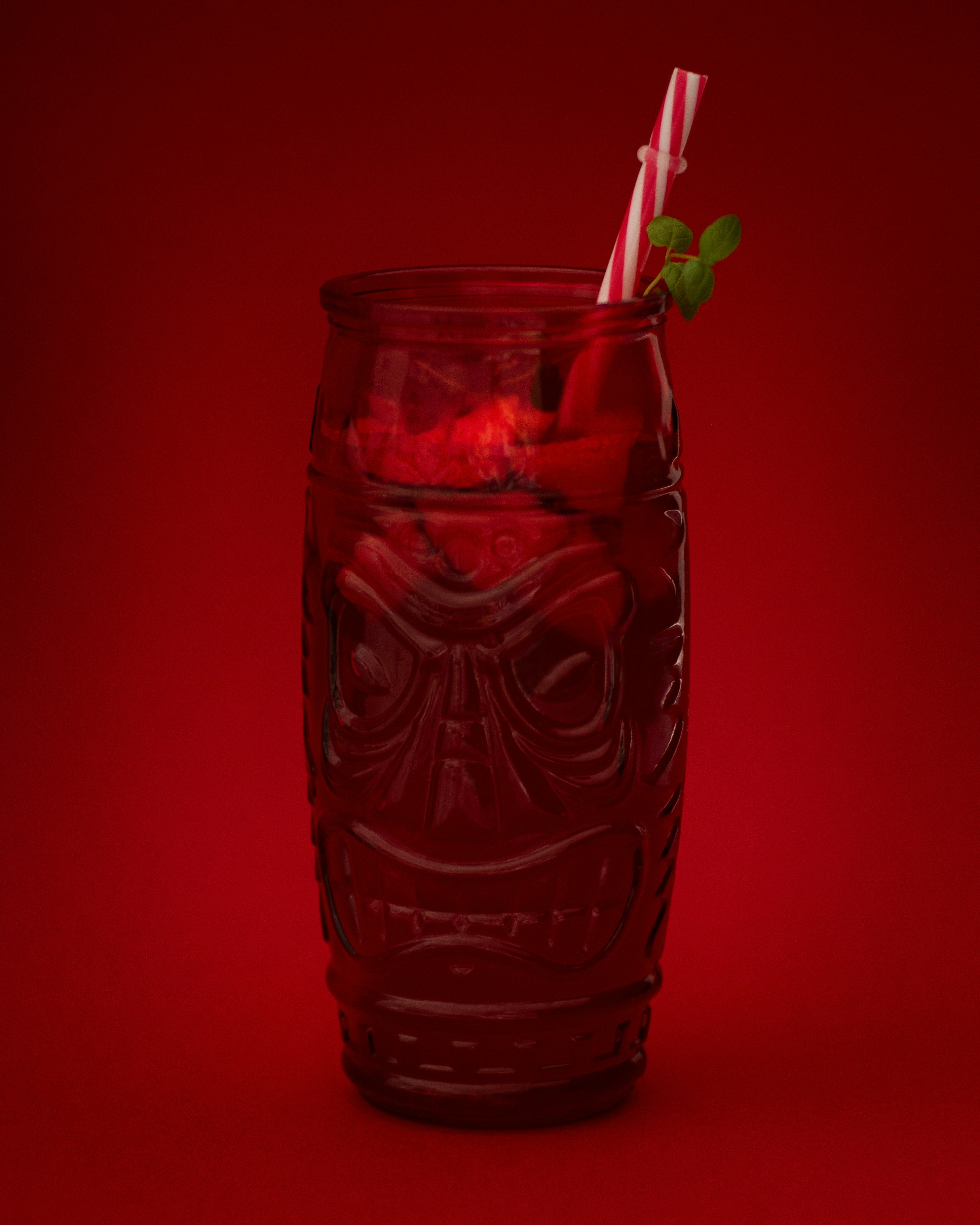 clear drinking glass with red liquid