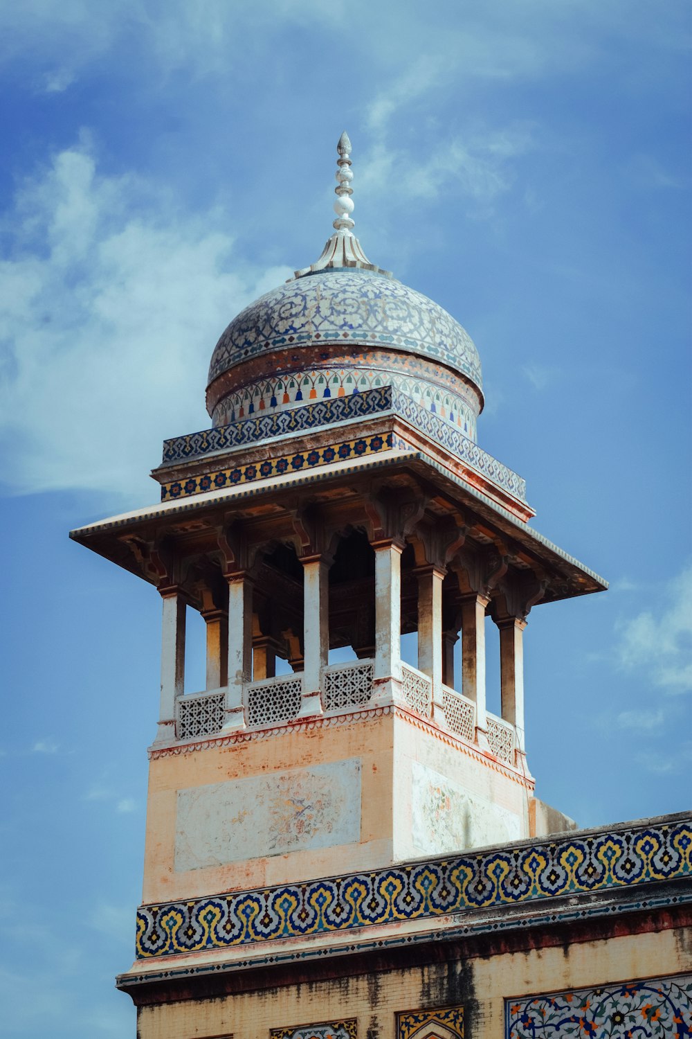 white and brown dome building under blue sky during daytime